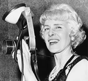 Washington D Prints: Clare Booth Luce tries out a photographer's camera at a Go with Goldwater dinner