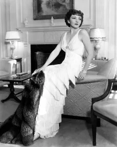 2017 Prints: Claudette Colbert in fringed gown and silver fox cape, 1937