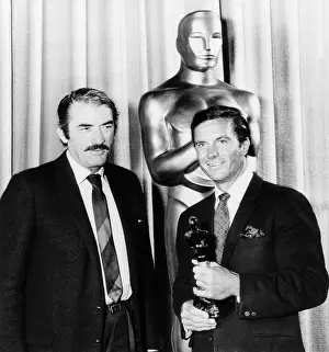 Presentation Prints: Cliff Robertson (right) receives a belated Best Actor Oscar for his film Charley