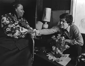 Clinton Prints: Bill Clinton campaigning in the Arkansas home of an African American women in 1977