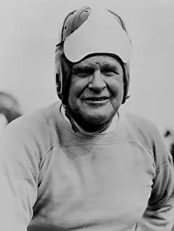 Teams Prints: Coach Glenn Pop Warner, wearing football headgear