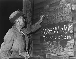 Kentucky Prints: A coal loader putting up his check at the end of day's work on Friday, Sept. 13, 1946