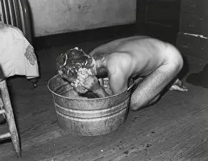 West Virginia Prints: Coal miner Milong Bond taking a bath from a metal wash basin