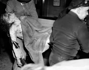 Burned Prints: Coconut Grove Nightclub Fire. The body of a young female victim is removed from the nightclub