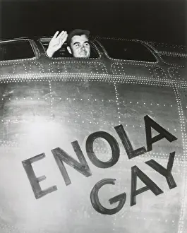 Lcgr1404 Prints: Col. Paul W. Tibbets, Jr. pilot of the ENOLA GAY waves from his cockpit before the takeoff