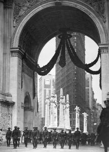 December Prints: Colonel Donovan and staff of 165th Infantry passing under the Victory Arch