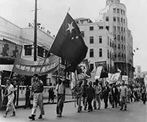 Lcgr1411 Prints: Communist marchers parade along the Pearl River waterfront in Canton (Guangzhou)