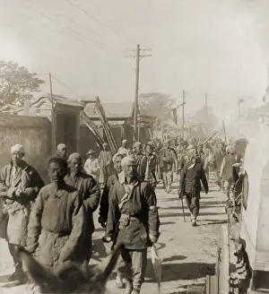 Uprising Prints: Company of Boxers walking on a street in Tianjin (Tientsin), China, in June 1900