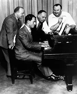 Composer Prints: Composer George Gershwin at the piano, ca. 1930. Courtesy: CSU Archives/Everett Collection