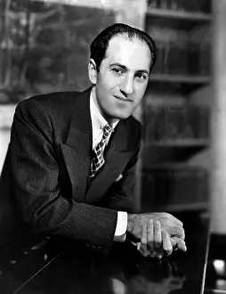 Composer Prints: Composer George Gershwin at the piano in his New York apartment