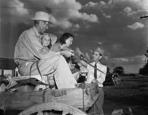 Political Campaigns Prints: Congressman Lyndon Johnson campaigning with a family on a horse drawn wagon in Texas May 31 1941