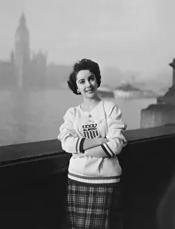 Plaid Skirt Prints: CONSPIRATOR, Elizabeth Taylor taking a stroll along the Thames River while on location in London