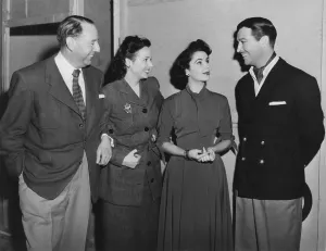 Images Dated 8th June 2015: CONSPIRATOR, from left: director Victor Saville arm in arm with visitor Jessie Matthews