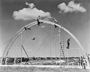 Lcgr1409 Prints: Construction workers on airplane hangar with prefabricated Rilco glued laminated wooden arches
