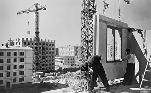Construction Prints: Construction workers building an eighty unit apartment building