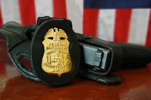Contemporary FBI badge and gun with American flag