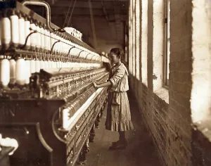 North Carolina Prints: Cotton Mill. An underage girl tends a cotton spinner for 48 cents a day
