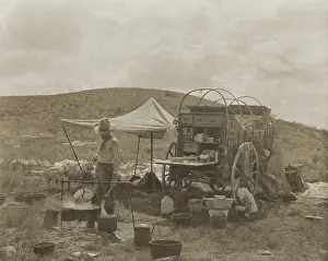 Workers Prints: A cowboy cooks at a chuck wagon