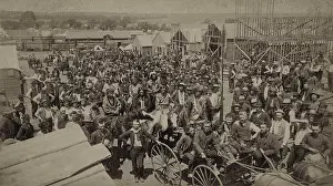 Migration Prints: Crowd of men, most looking toward the photographer