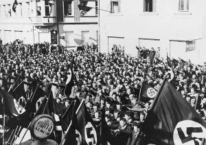 Austria Prints: Crowd in Oberwart, Austria, saluting Nazi flags celebrating the Anschluss of Austria