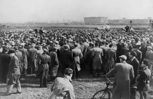 Great Britain Prints: Crowd of striking ship repair workers listening to men with loudspeakers at rally at Custom House Fields
