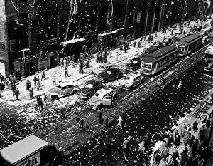 Confetti Prints: Crowds on the corner of 42nd Street and Lexington Avenue in New York celebrate the end of World War II