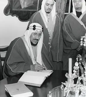 Traditional Costume Prints: Crown Prince Amir Saud of Saudi Arabia signs the guest book at Mount Vernon