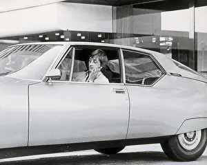Cruyff Prints: CRUYFF, Johan (1948). Cruyff driving a Citroen through the streets of Barcelona (1973)