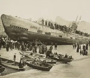 Curious civilians swarm over a stranded German U-boat on Englands south coast, 1918. In front of the conning tower is a cannon, which was lowered into the hull when submerged