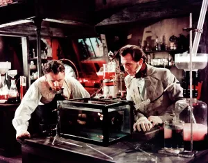 Mad Scientist Prints: THE CURSE OF FRANKENSTEIN, from left: Robert Urquhart, Peter Cushing, 1957
