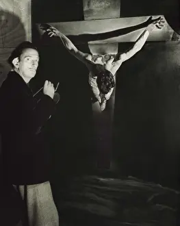 Dali Prints: DALI, Salvador (1904-1989). Portrait of Salvador Dali painting his work 'Christ crucified' in 1954