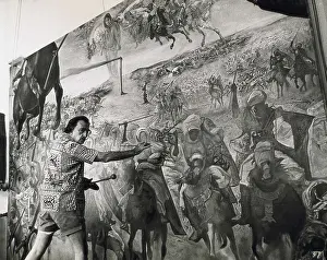 Dali Prints: DALI, Salvador (1904-1989). Salvador Dali painting his work 'The Battle of Tetuan' in 1961
