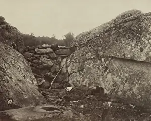 Alexander Prints: A dead Confederate soldier lies in the Devil's Den