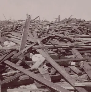 Texas Prints: A dead man under wood planks after the Galveston, Texas, hurricane of Sept 8, 1900