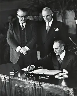 Vice Presidents Prints: Dean Acheson, Sec. of State, signs the North Atlantic Treaty establishing the NATO alliance