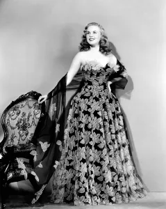 Deanna Prints: Deanna Durbin in hoop skirt styled lace fabric flowered evening dress designed by Howard Greer