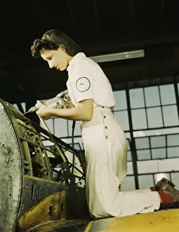 Skilled Laborers Prints: Defense worker riveting as part of her training to become a mechanic at the Naval Air Base