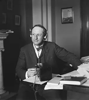 Headphones Prints: Democratic Sen. Pat Harrison intently listening to the 1936 Republican Convention in Cleveland