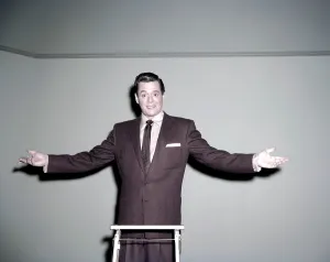 1950s Candids Prints: Desi Arnaz, at the top of the ladder at Desilu Productions, ca. mid-1950s