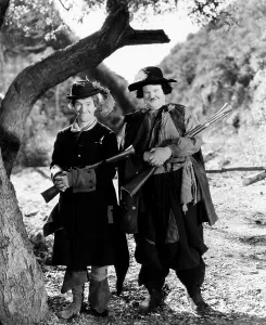 THE DEVIL'S BROTHER, from left: Stan Laurel, Oliver Hardy, 1933