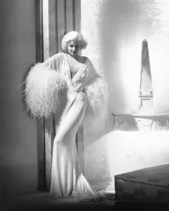 DINNER AT EIGHT, Jean Harlow, in a negligee by Adrian, 1933