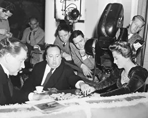 Hollywood Prints: Director Hitchcock directing a scrabble scene with Joan Fontaine in SUSPICION