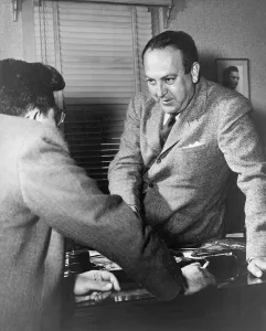 Producers Prints: Director Robert Wise (1914-2005) and producer Val Lewton (left) conversing across a desk
