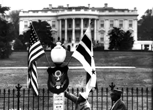 Sign Prints: US & District of Columbia flags decorate the grounds of the White House