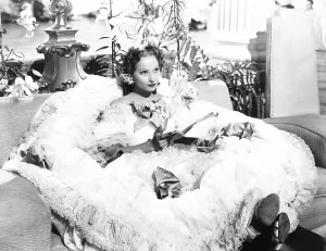 Script Prints: THE DIVORCE OF LADY X, Merle Oberon spread out with her script on set, 1938