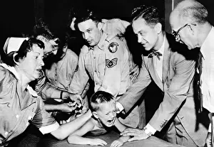 Remedies Prints: Several doctors and nurses restrain young Ernest Booth