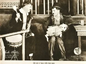 Spoon Prints: A DOG'S LIFE, right: Charlie Chaplin; dog on lap: Mut'; on lobbycard, 1918