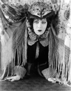 Funny Hat Prints: A DOLL'S HOUSE, Alla Nazimova, in a cat hat designed by Natasha Rambova, 1922