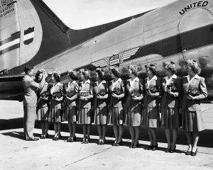 Line Prints: Don F. Magarrell gives new United Airlines stewardesses their wings