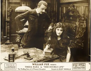 HER DOUBLE LIFE, right: Theda Bara on lobbycard, 1916, TM and Copyright 20th Century Fox Film Corp. All rights reserved./courtesy Everett Collection